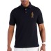 EMPORIO ARMANI POLO A MANICA CORTA BLU NAVY CON LOGO AQUILA CARTOON RICAMATO ORANGE